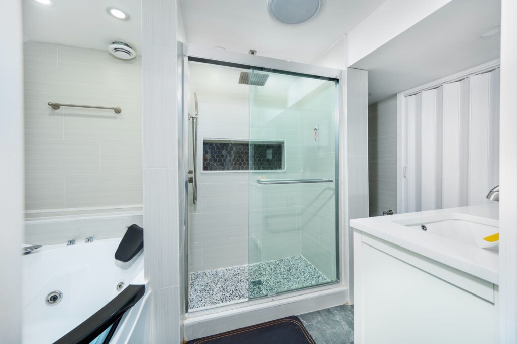 Luxury master bathroom remodel in Ottawa by Mo Reno with marble finishes, custom cabinetry, and integrated accent lighting.