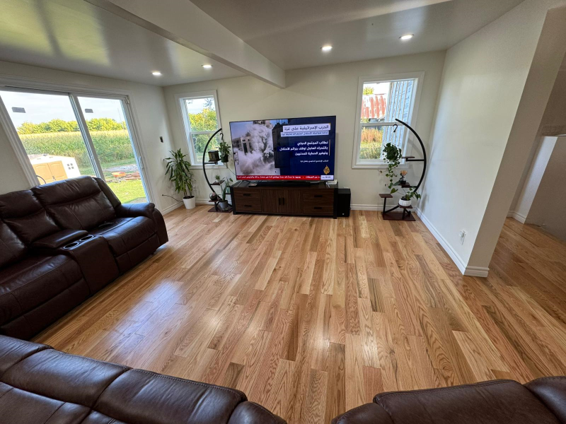 Completed interior renovation by Mo Reno in Ottawa, featuring a modern open-concept living space.